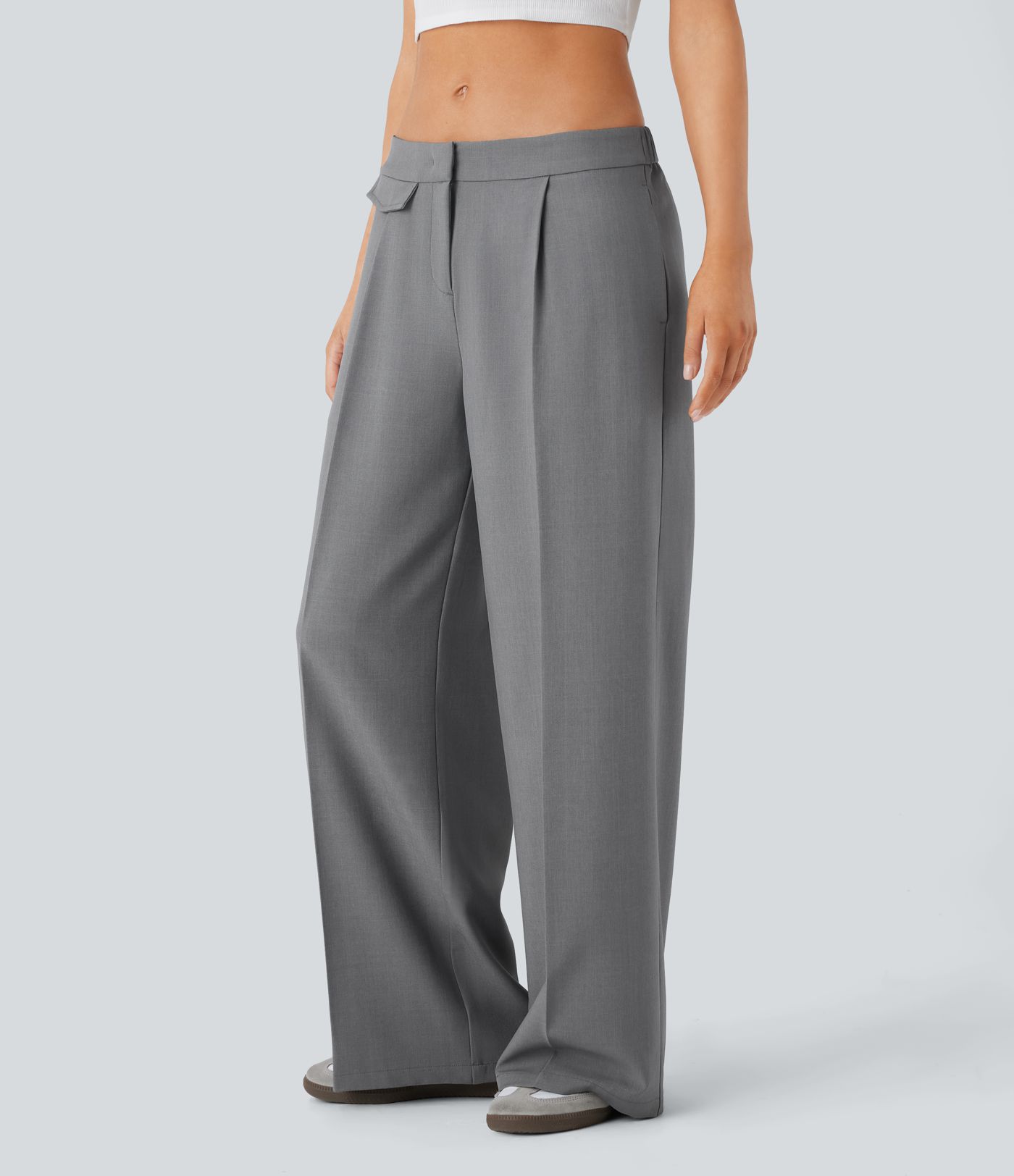 Pantalon décontracté taille basse jambes larges avec poches zippées sur les côtés