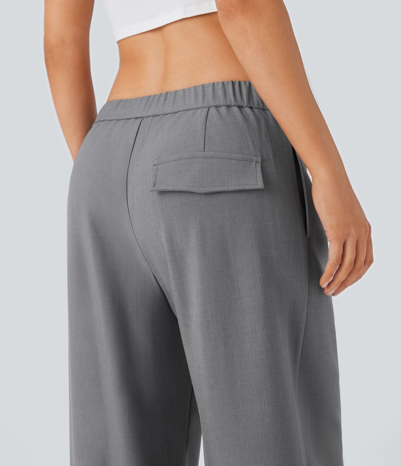 Pantalon décontracté taille basse jambes larges avec poches zippées sur les côtés