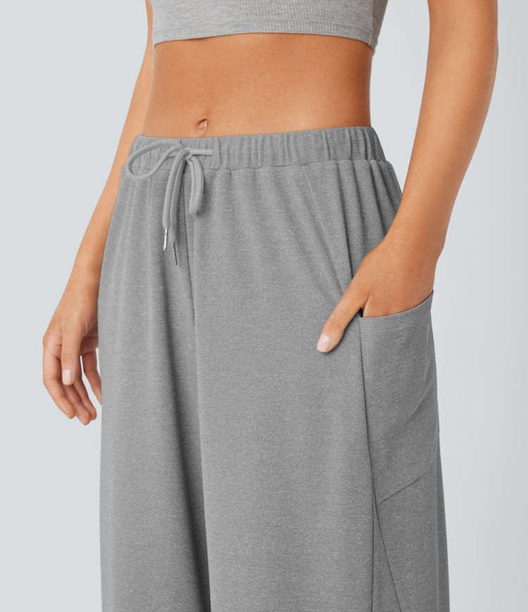 Pantalón pierna ancha bolsillo lateral cordón tiro medio