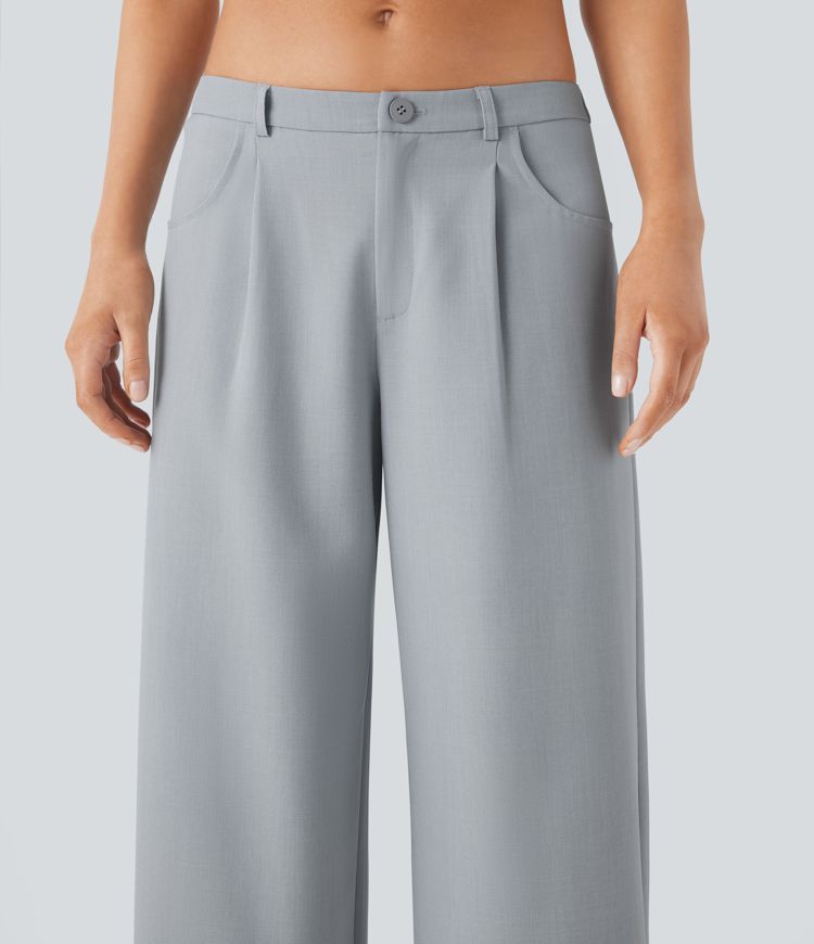 Pantalon tailleur ample à taille basse avec poches latérales et lien à nouer