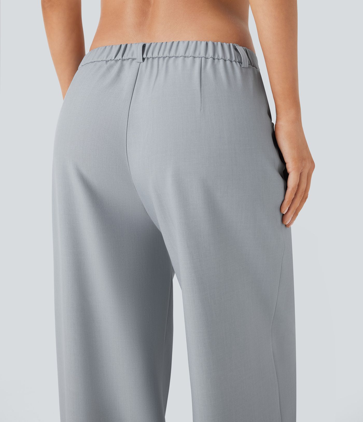 Pantalon tailleur ample à taille basse avec poches latérales et lien à nouer