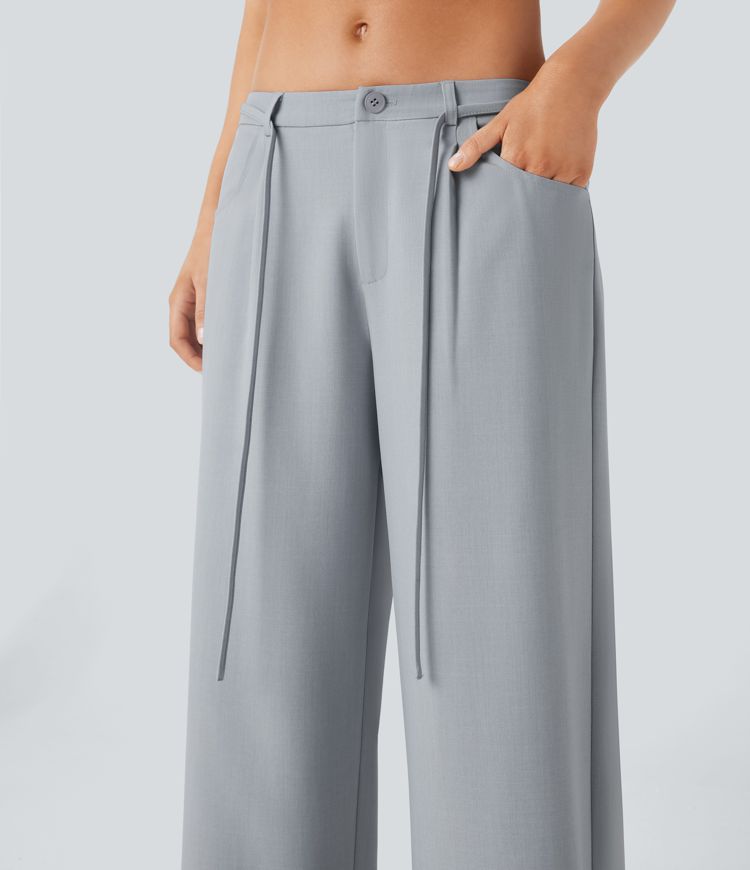 Pantalon tailleur ample à taille basse avec poches latérales et lien à nouer