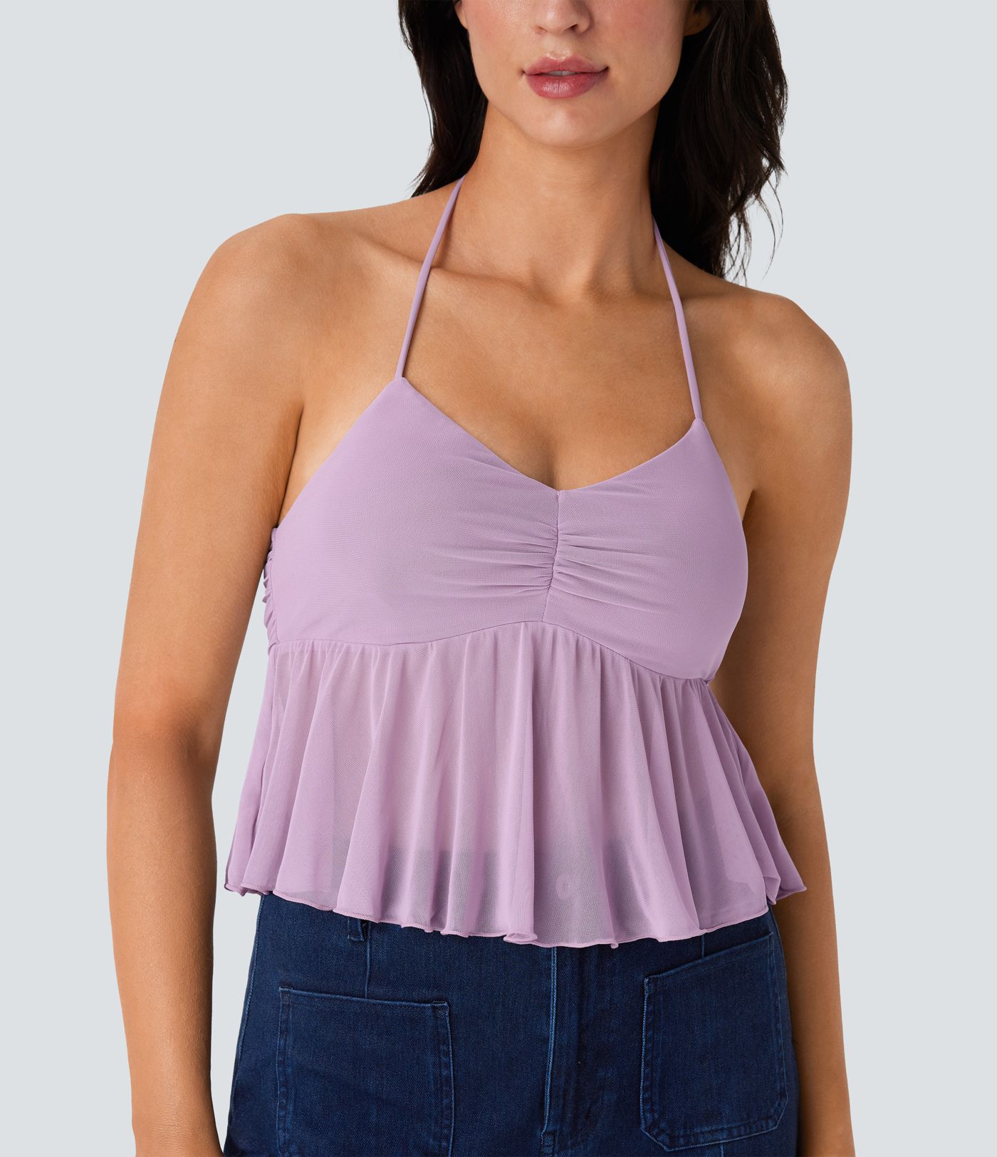 Casual halterneck backless tank top with ruched knit front and ruffled hem