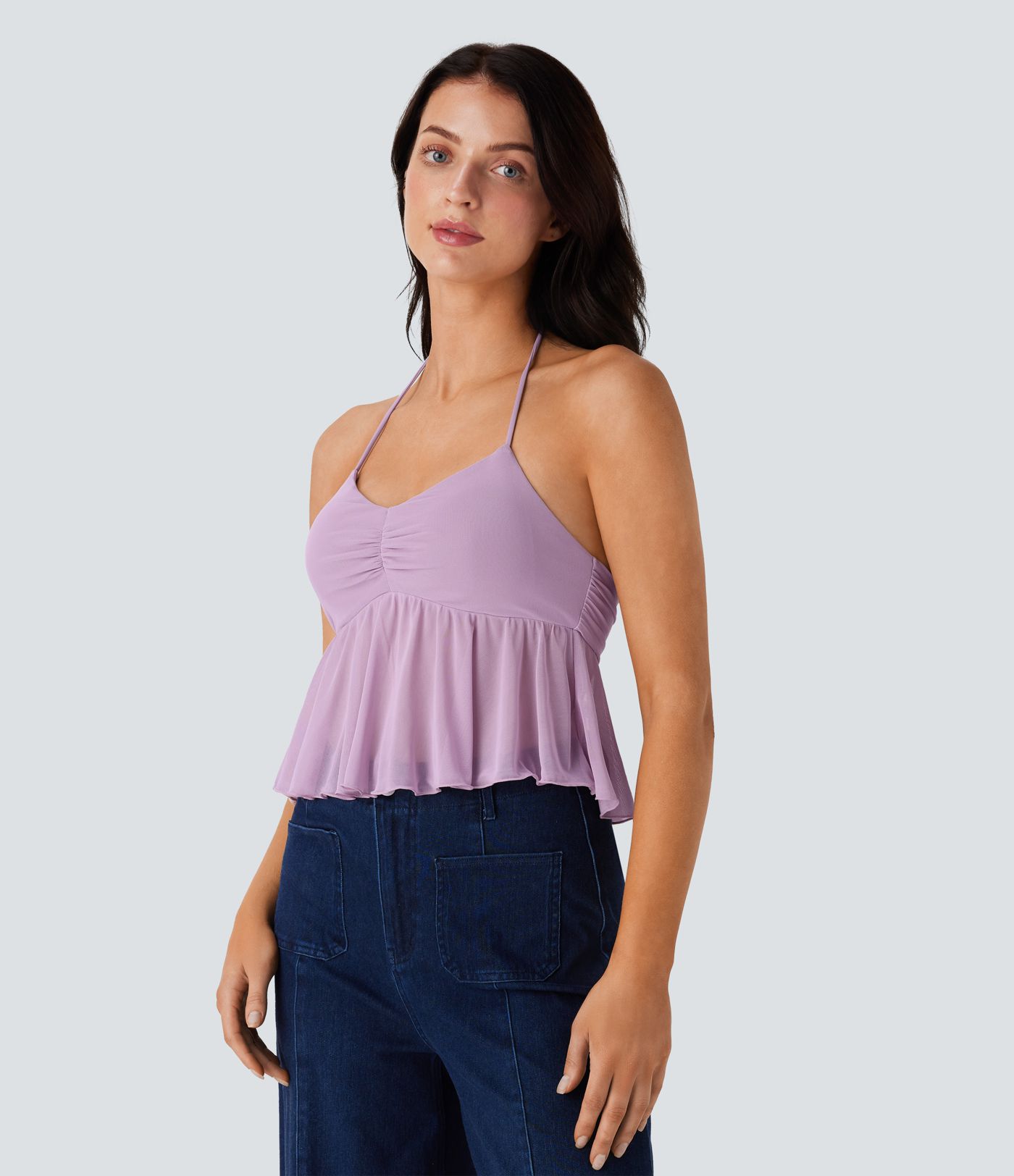 Casual halterneck backless tank top with ruched knit front and ruffled hem