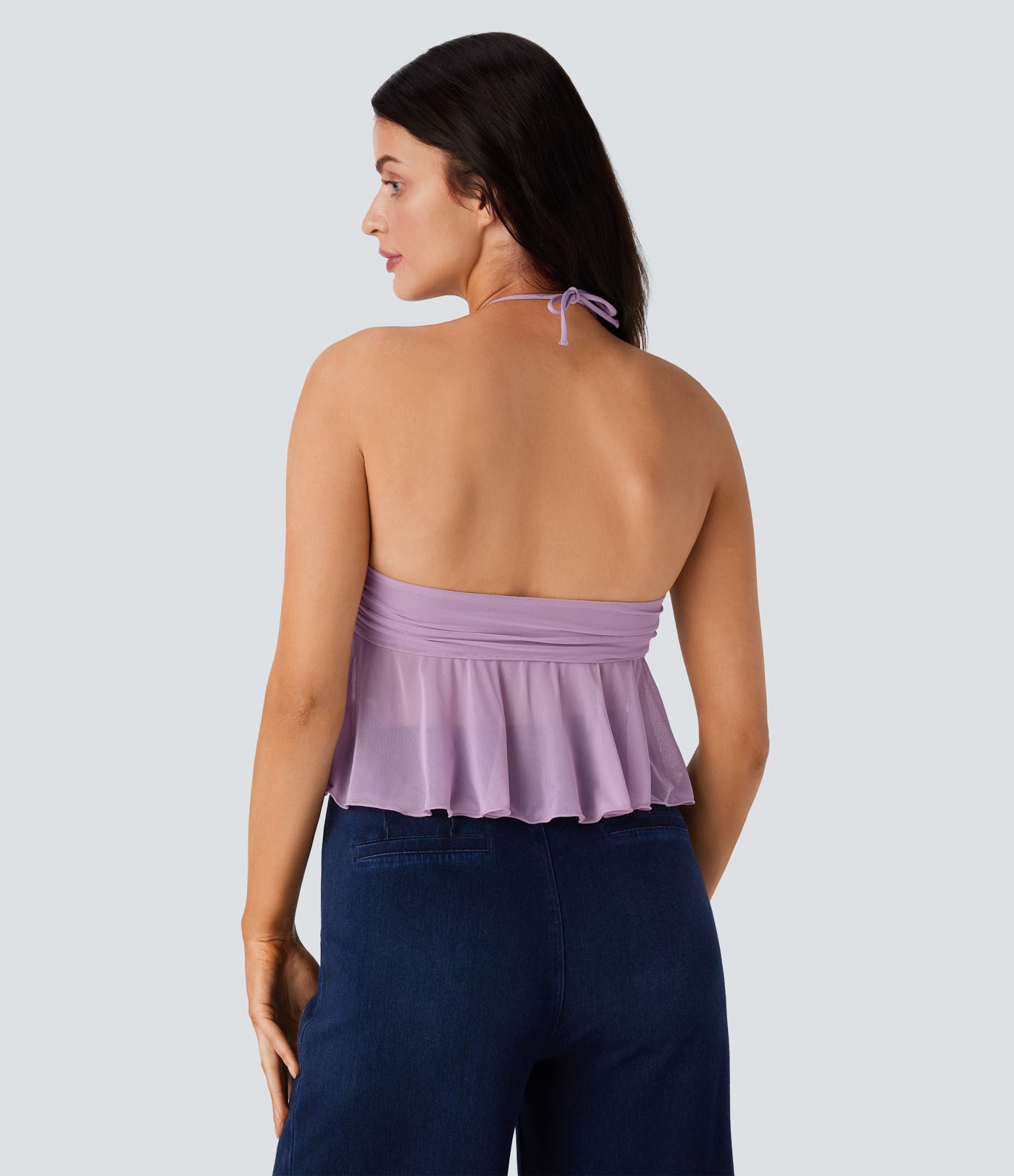 Casual halterneck backless tank top with ruched knit front and ruffled hem