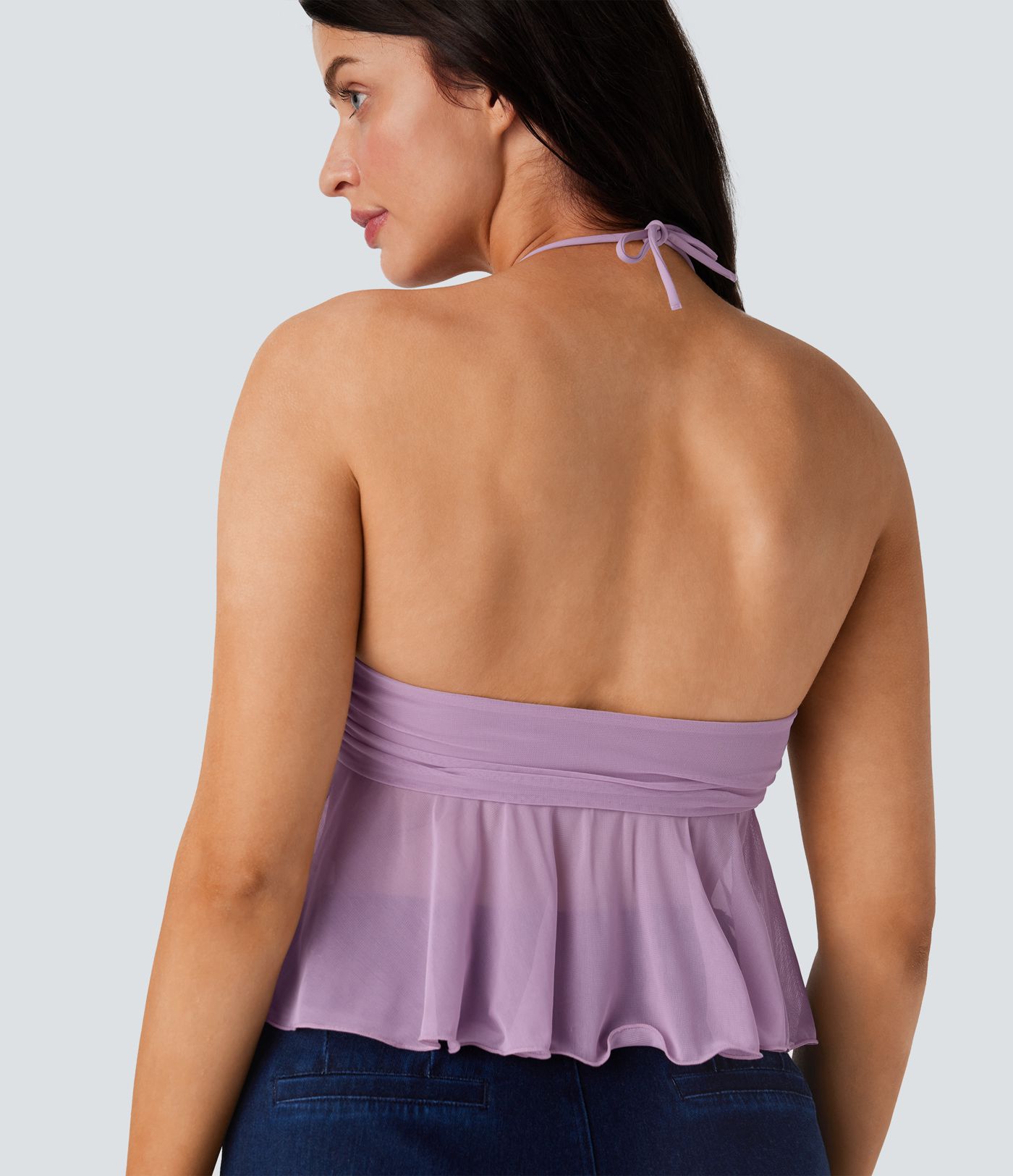 Casual halterneck backless tank top with ruched knit front and ruffled hem