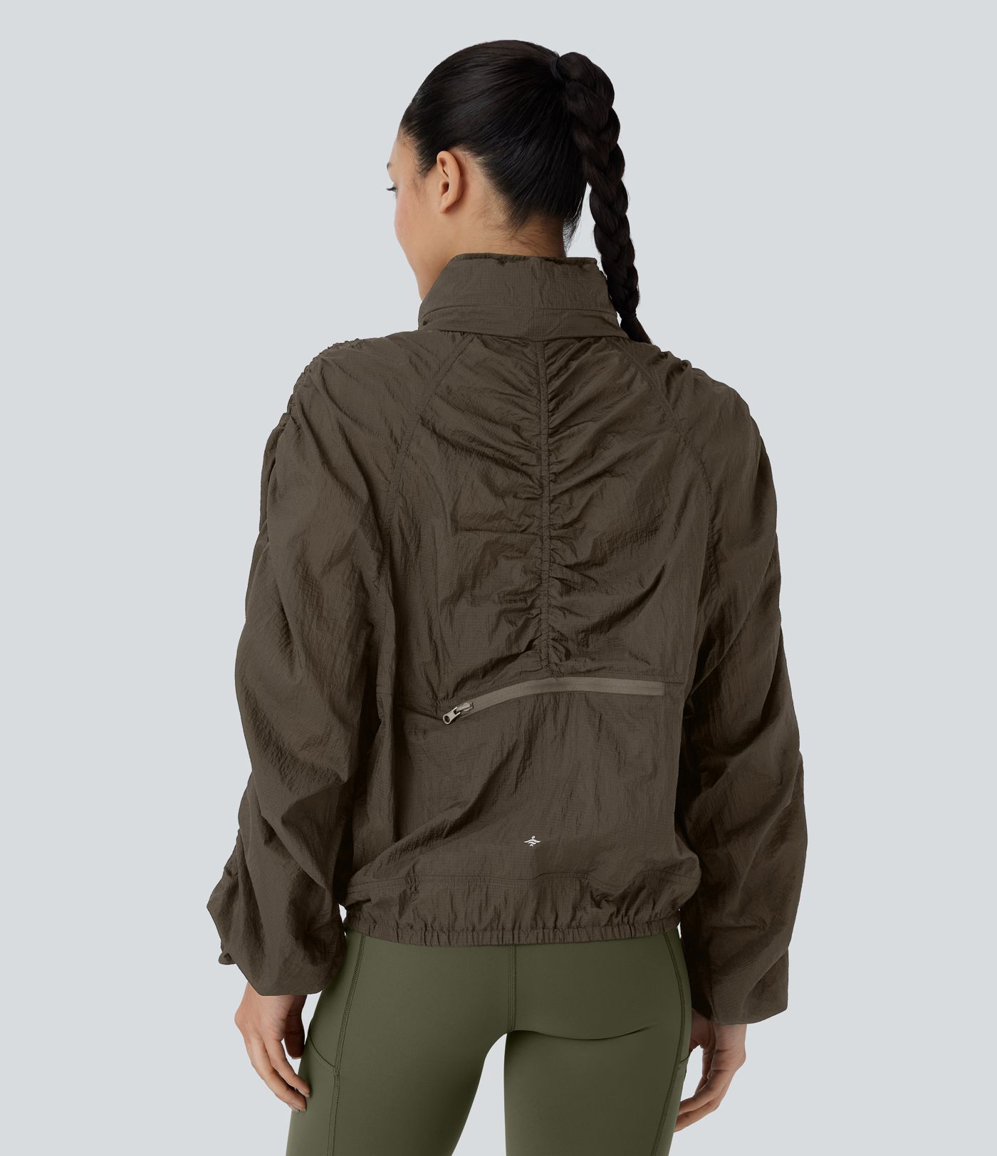 Veste de randonnée imperméable légère et compactable avec capuche rabattable, manches froncées et poches latérales