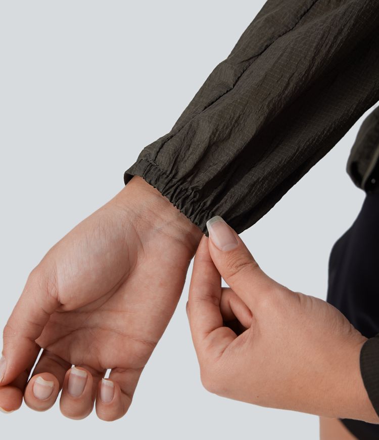 Veste de randonnée imperméable à capuche avec manches longues, fermeture éclair, poches latérales et cordon de serrage ajustable