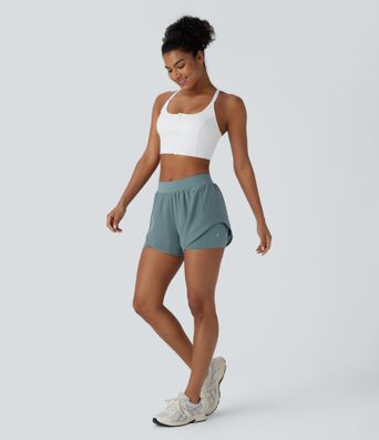 Pantalón corto yoga 2 en 1 tiro medio bolsillo lateral malla contrastante dobladillo curvo 7.5 cm