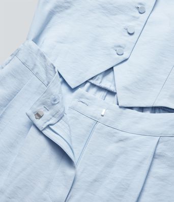 Mono de oficina de pierna ancha con cuello halter botones y bolsillos