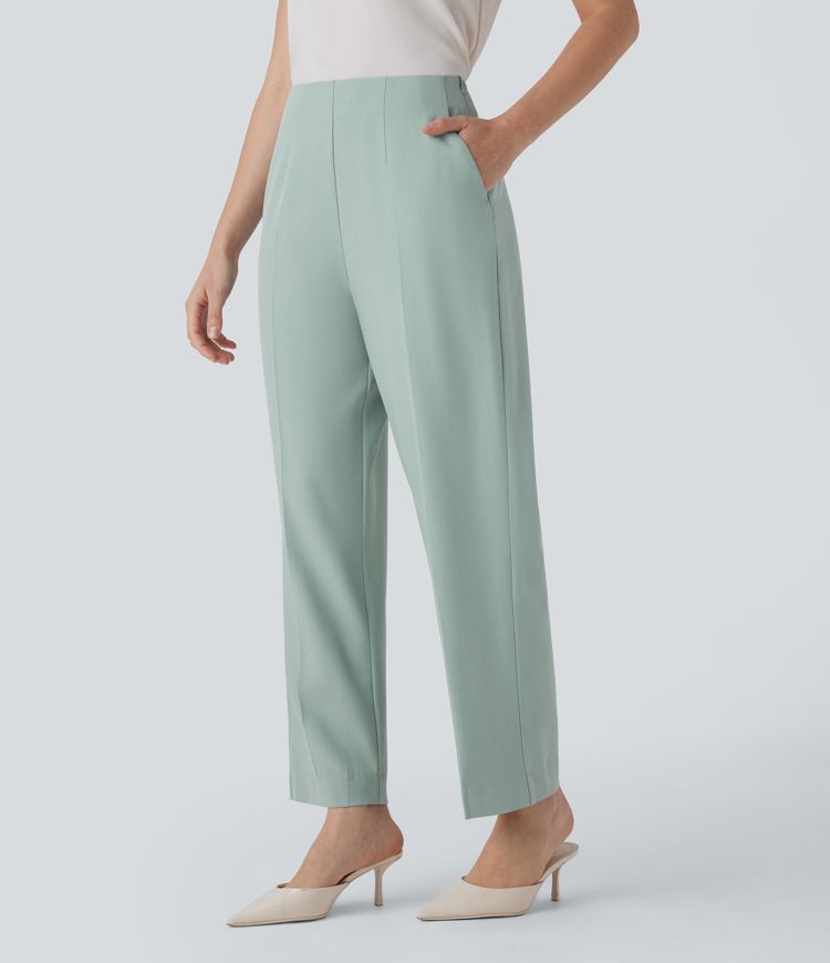 Schmal zulaufende Stoffhose mit hohem Bund, Seitentaschen und unsichtbarem Reißverschluss