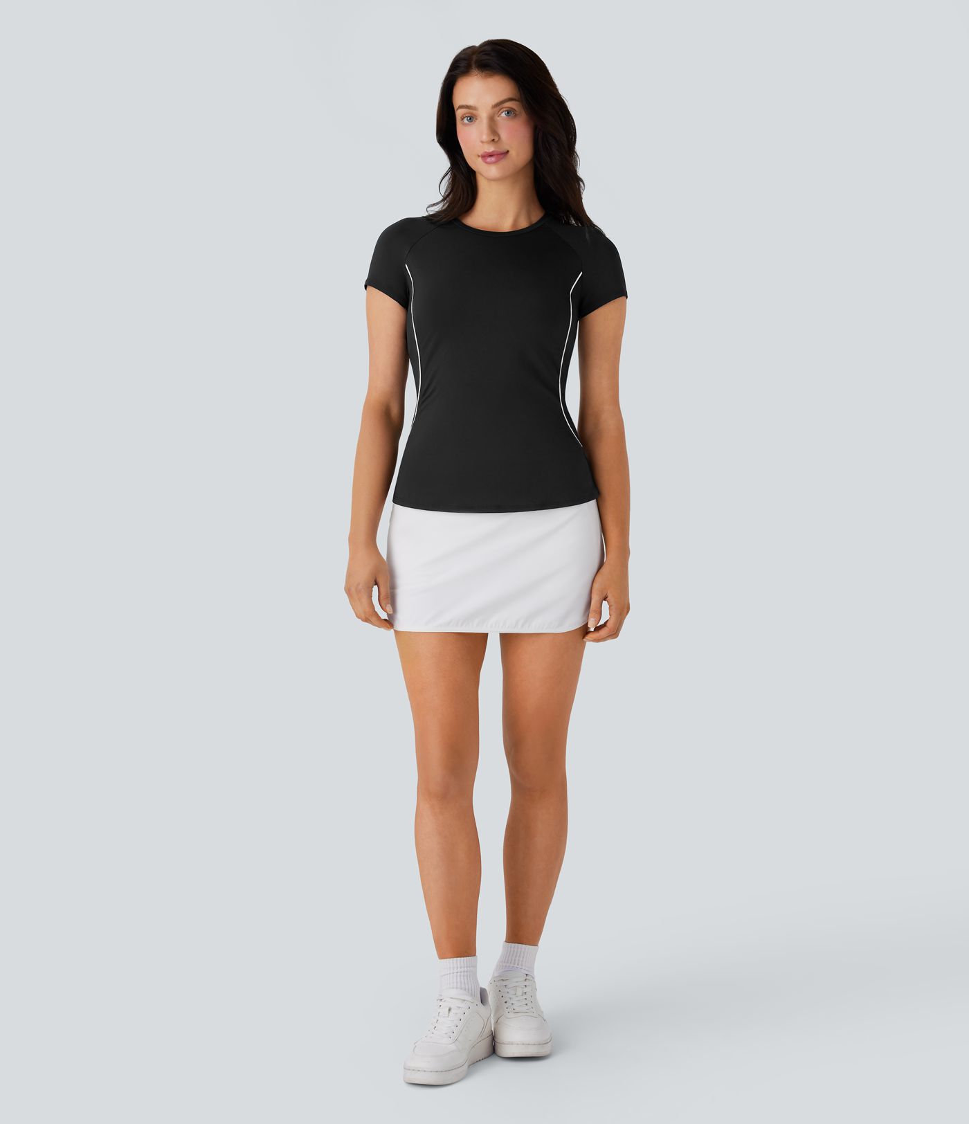 Haut de sport léger pour golf avec manches raglan, blocs de couleur, bande et ourlet arrondi, coupe ajustée
