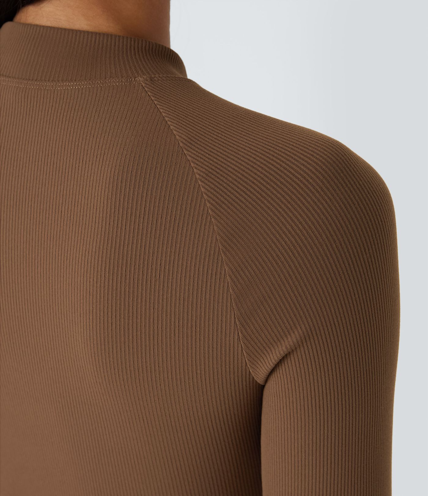 Softlyzero™ relaxed ribbed bodysuit with high neck, long raglan sleeves, and slim fit