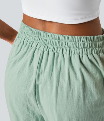Lässige Baumwollhose mit hoher Taille und Knopfseitentaschen und weitem Bein