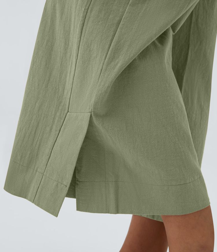 Pantalon palazzo 7/8 taille haute à plis, poches multiples et fentes latérales, aspect lin