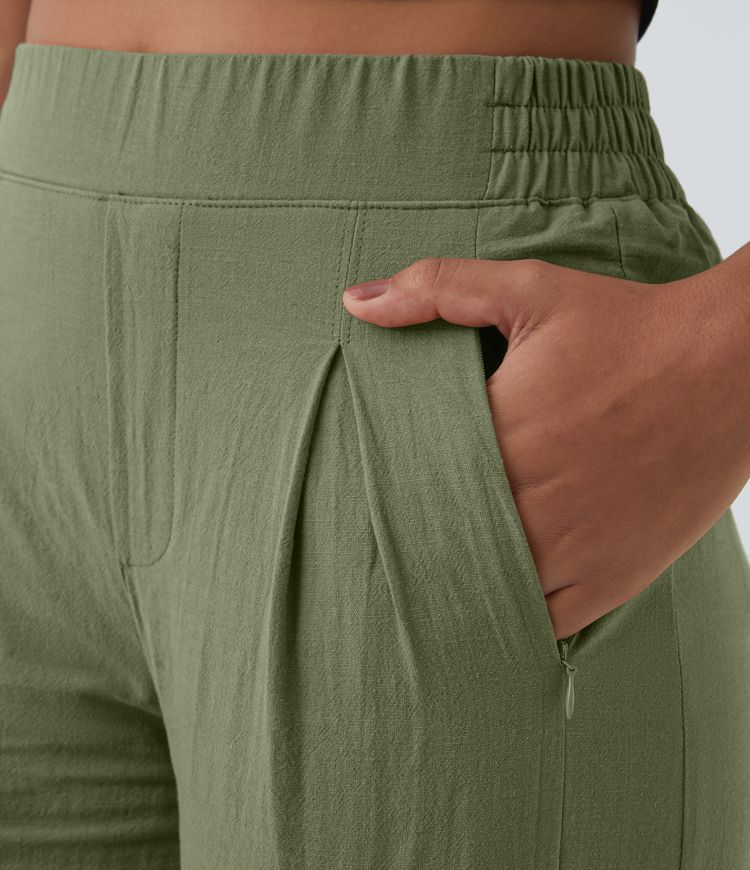 Pantalon palazzo 7/8 taille haute à plis, poches multiples et fentes latérales, aspect lin