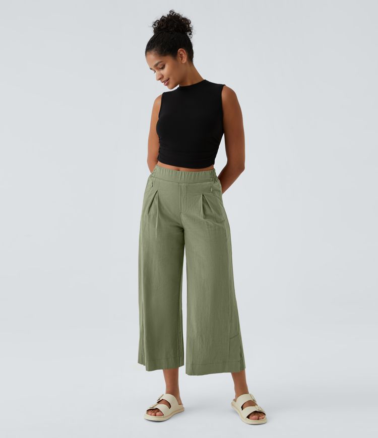 Pantalon palazzo 7/8 taille haute à plis, poches multiples et fentes latérales, aspect lin