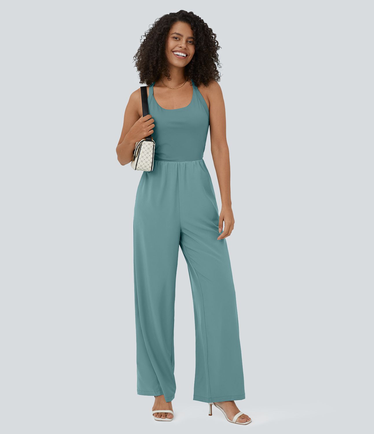 Mono Breezeful™ yoga secado rápido fluido bolsillo lateral sin mangas retorcido cut out sin espalda