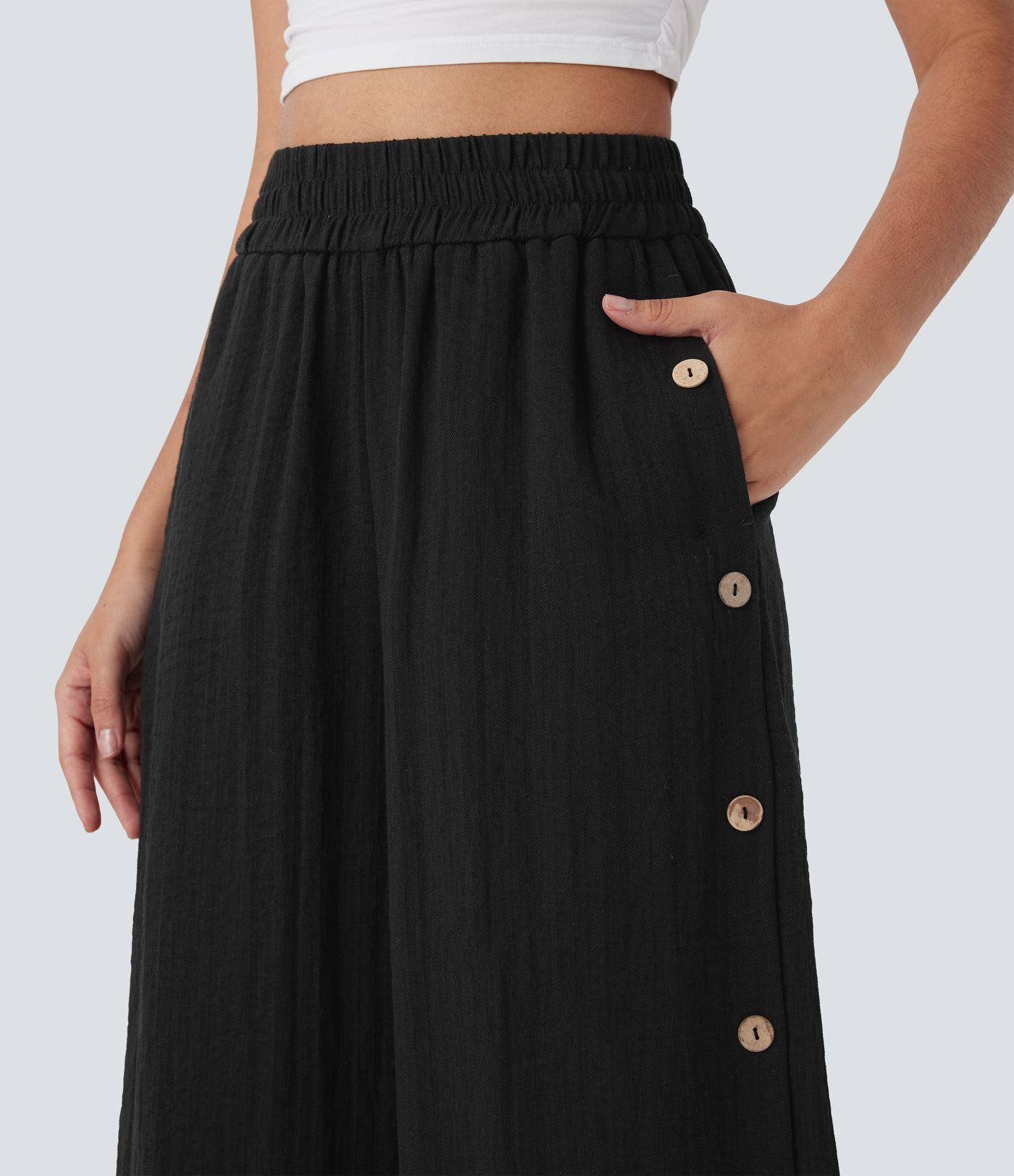 Lässige 7/8-Hose mit weitem Bein und hoher Taille, Seitentaschen und dekorativen Knöpfen