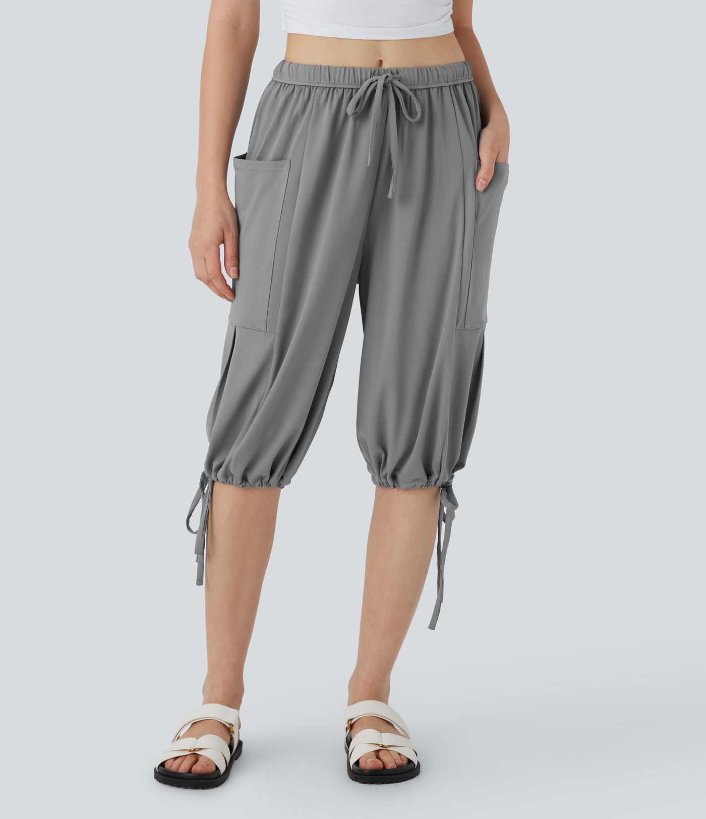 Lässige, fließende Pedal-Pusher-Palazzohose mit mittelhohem Bund, Seitentaschen, Kordelzug und weitem Bein