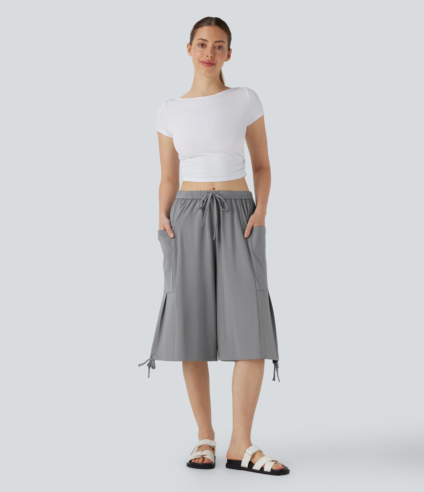 Lässige, fließende Pedal-Pusher-Palazzohose mit mittelhohem Bund, Seitentaschen, Kordelzug und weitem Bein