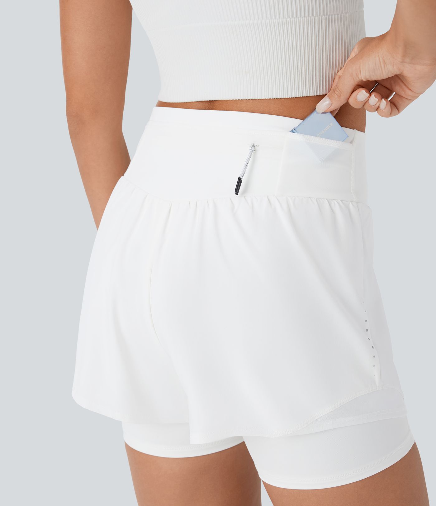 Short 2-en-1 de course gainant taille haute réfléchissant avec empiècements résille contrastés et séchage rapide avec poches SpeedWave™