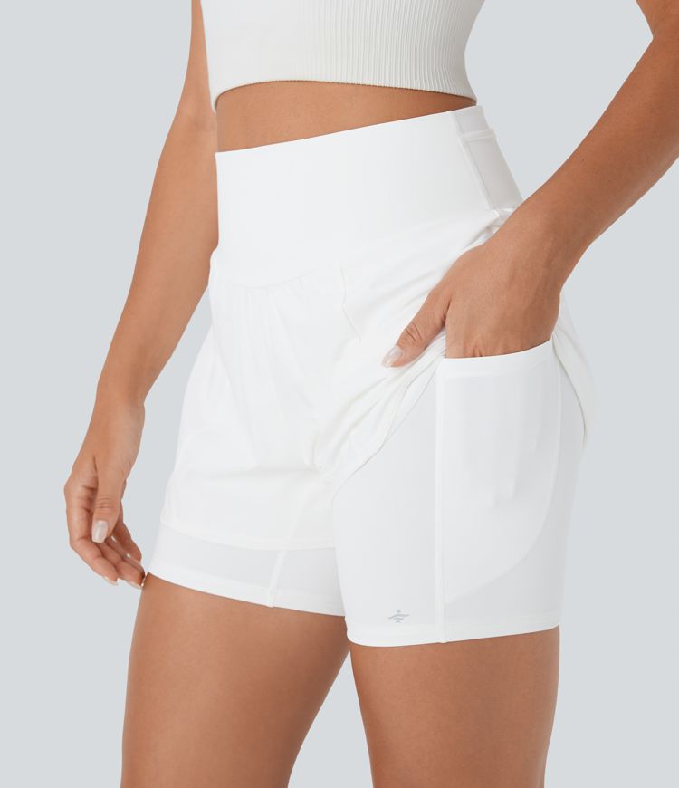 Short 2-en-1 de course gainant taille haute réfléchissant avec empiècements résille contrastés et séchage rapide avec poches SpeedWave™