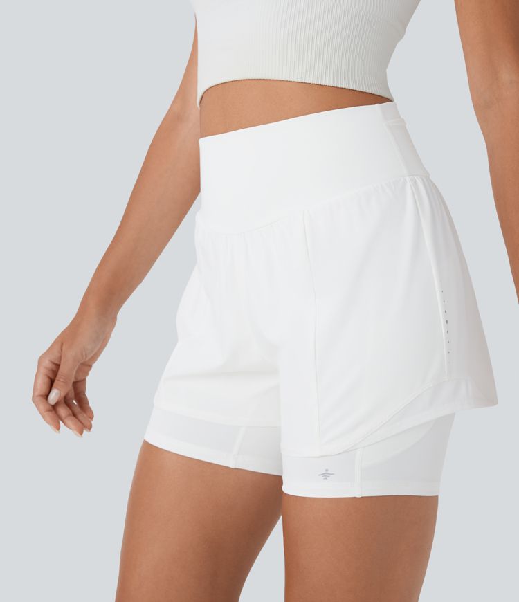 Short 2-en-1 de course gainant taille haute réfléchissant avec empiècements résille contrastés et séchage rapide avec poches SpeedWave™