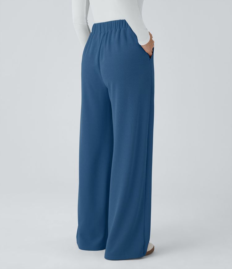 Pantalón tiro alto botón bolsillo lateral plisado pierna ancha