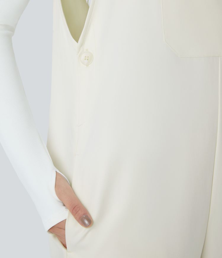 Adjustable strap with water-resistant and abrasion-resistant properties, multiple pockets, button closure, outdoor overall.