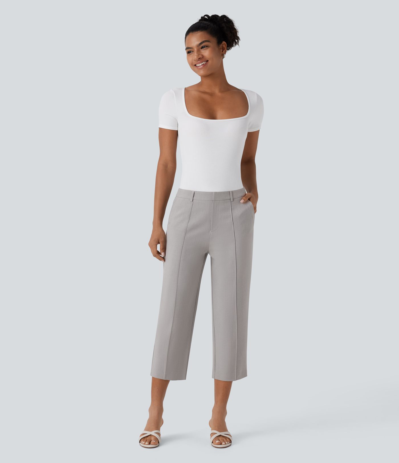 Pantalón capri tiro medio cremallera múltiple bolsillo