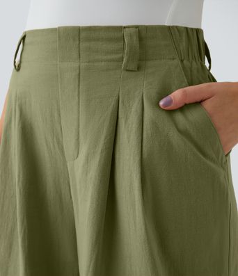 Pantalón tiro alto bolsillo lateral plisado pierna ancha