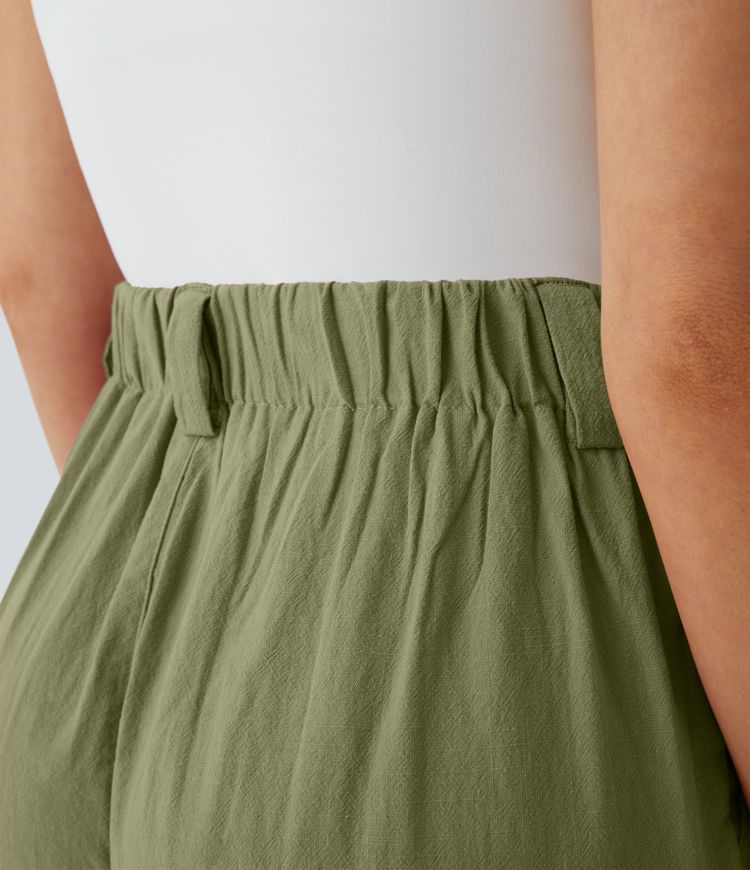 Pantalón tiro alto bolsillo lateral plisado pierna ancha