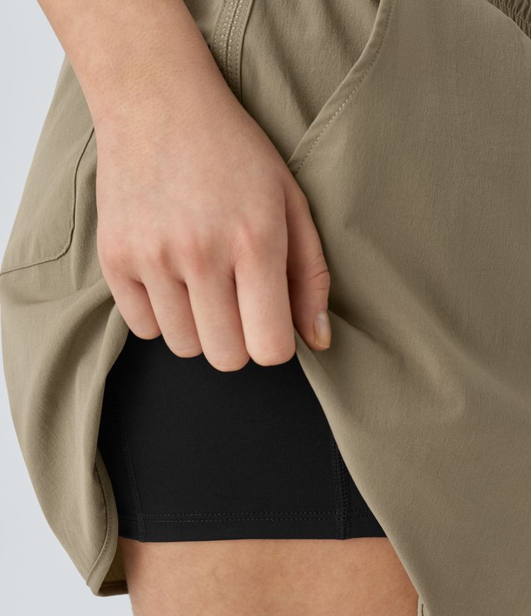 Mittlere Steighöhe Farbblock reflektierende Taschen Gebogener Saum 2-in-1 Wandershorts