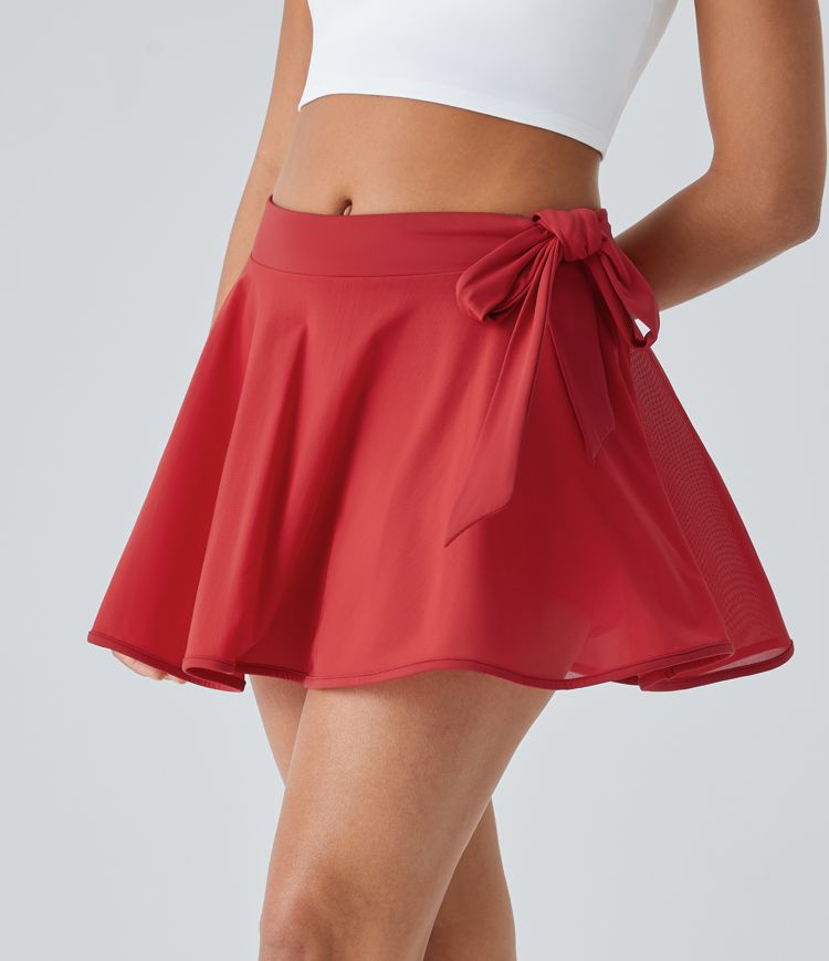 Minifalda baile acampanada malla contrastante bolsillo 2 en 1 tiro medio lazo lateral