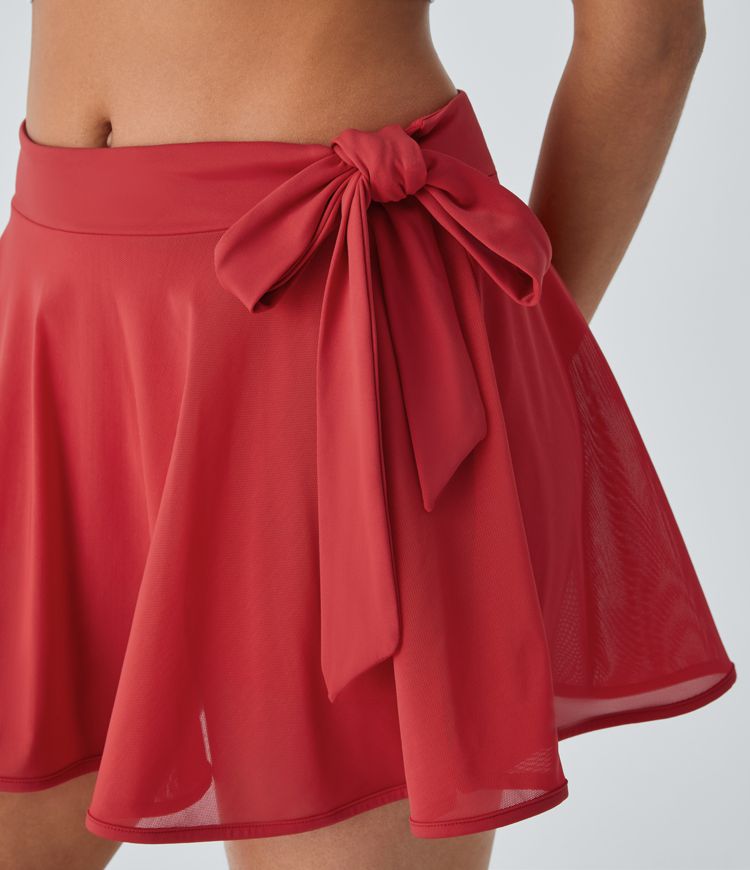 Minifalda baile acampanada malla contrastante bolsillo 2 en 1 tiro medio lazo lateral