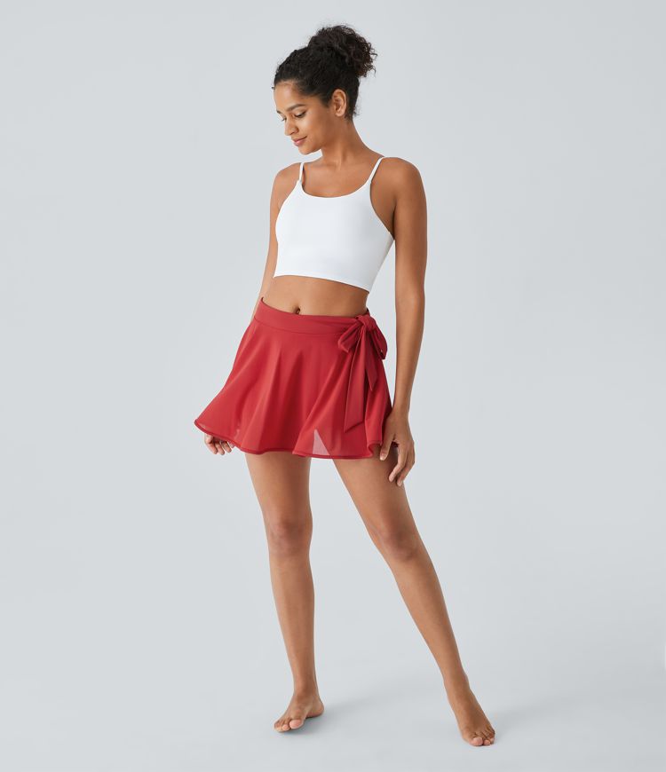 Minifalda baile acampanada malla contrastante bolsillo 2 en 1 tiro medio lazo lateral