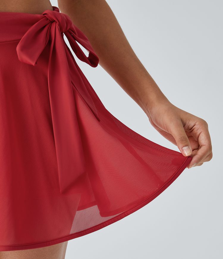 Minifalda baile acampanada malla contrastante bolsillo 2 en 1 tiro medio lazo lateral