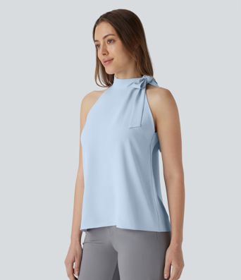 Blusa de oficina sin mangas con cuello halter y lazo decorativo