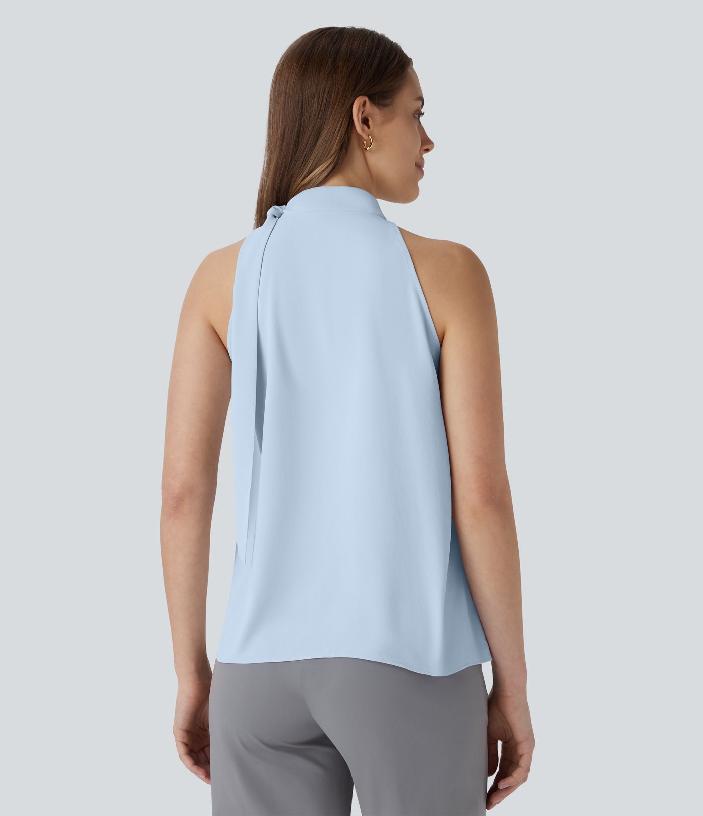 Blusa de oficina sin mangas con cuello halter y lazo decorativo