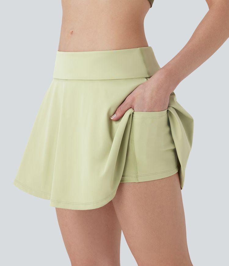 Falda de yoga mini 2 en 1 de tiro muy bajo con pliegues y bolsillos