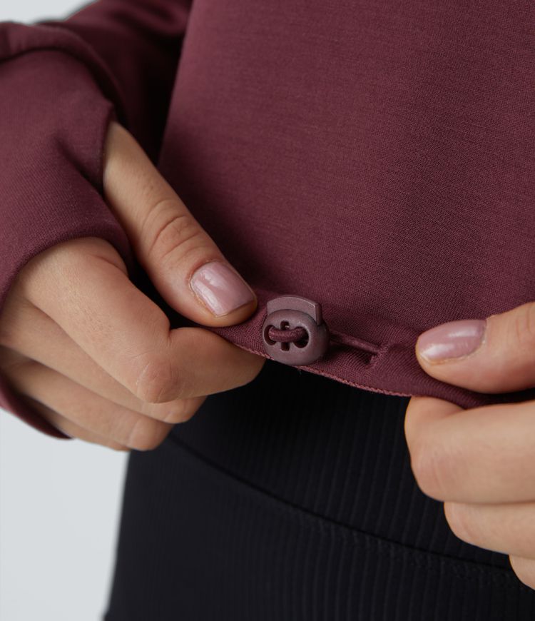 Sweat-shirt court décontracté avec demi-zip, passe-pouces et cordon ajustable à l'ourlet