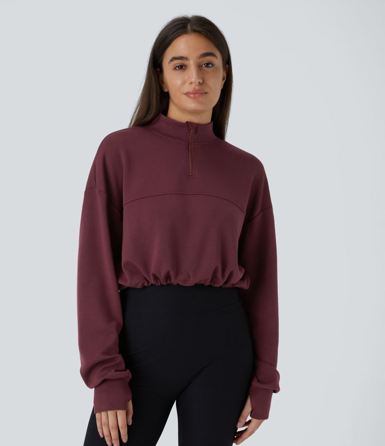 Sweat-shirt court décontracté avec demi-zip, passe-pouces et cordon ajustable à l'ourlet