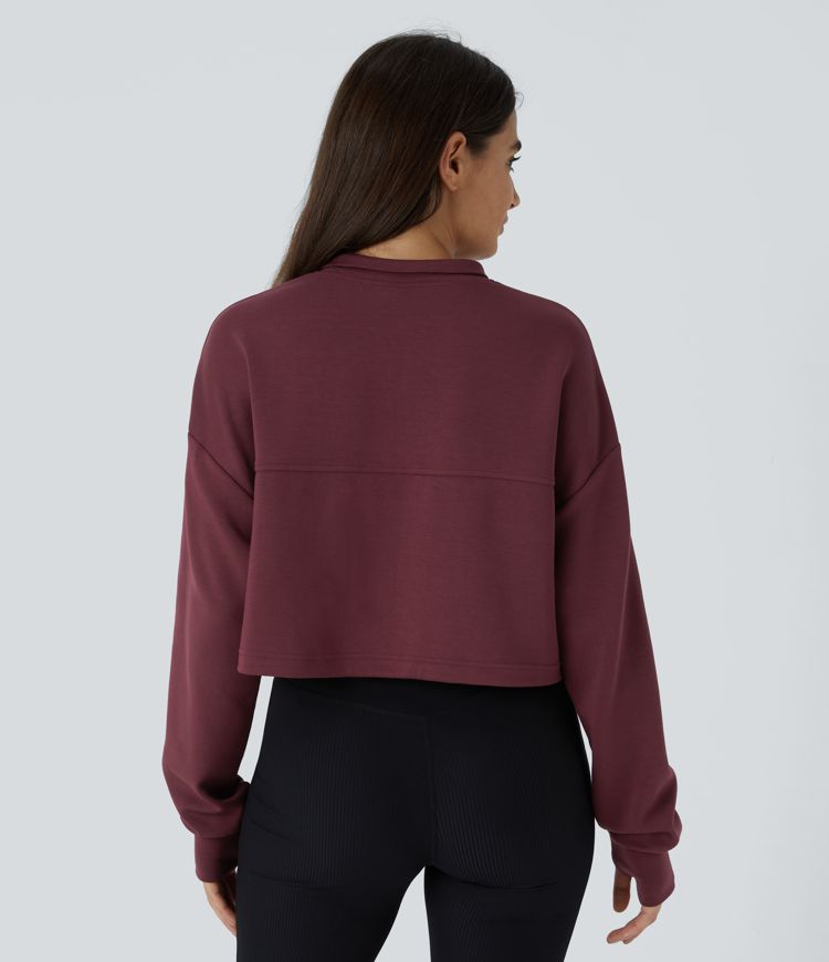 Sweat-shirt court décontracté avec demi-zip, passe-pouces et cordon ajustable à l'ourlet