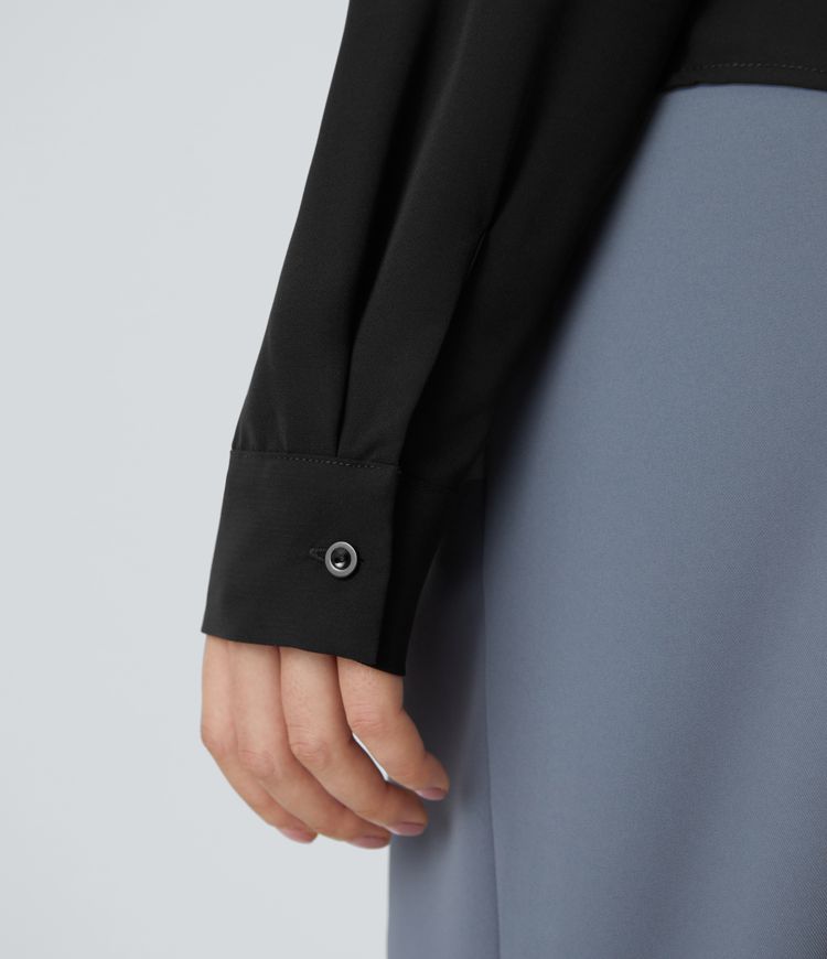 Haut de travail asymétrique à épaules dénudées et manches longues