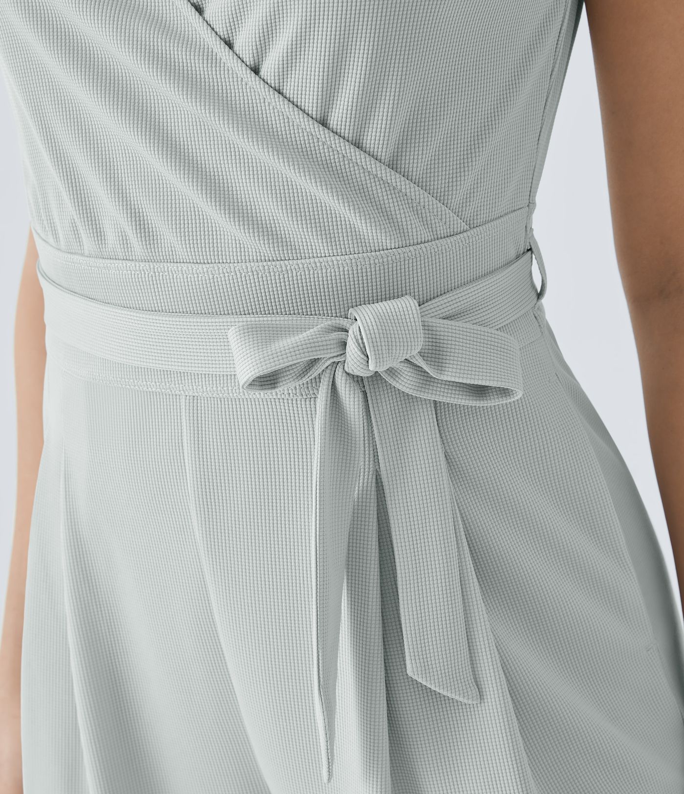 V-neck hidden zipper jumpsuit with belt, side pockets, and waffle texture for a casual look