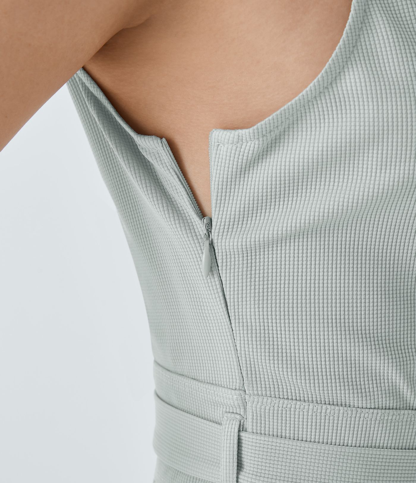 V-neck hidden zipper jumpsuit with belt, side pockets, and waffle texture for a casual look