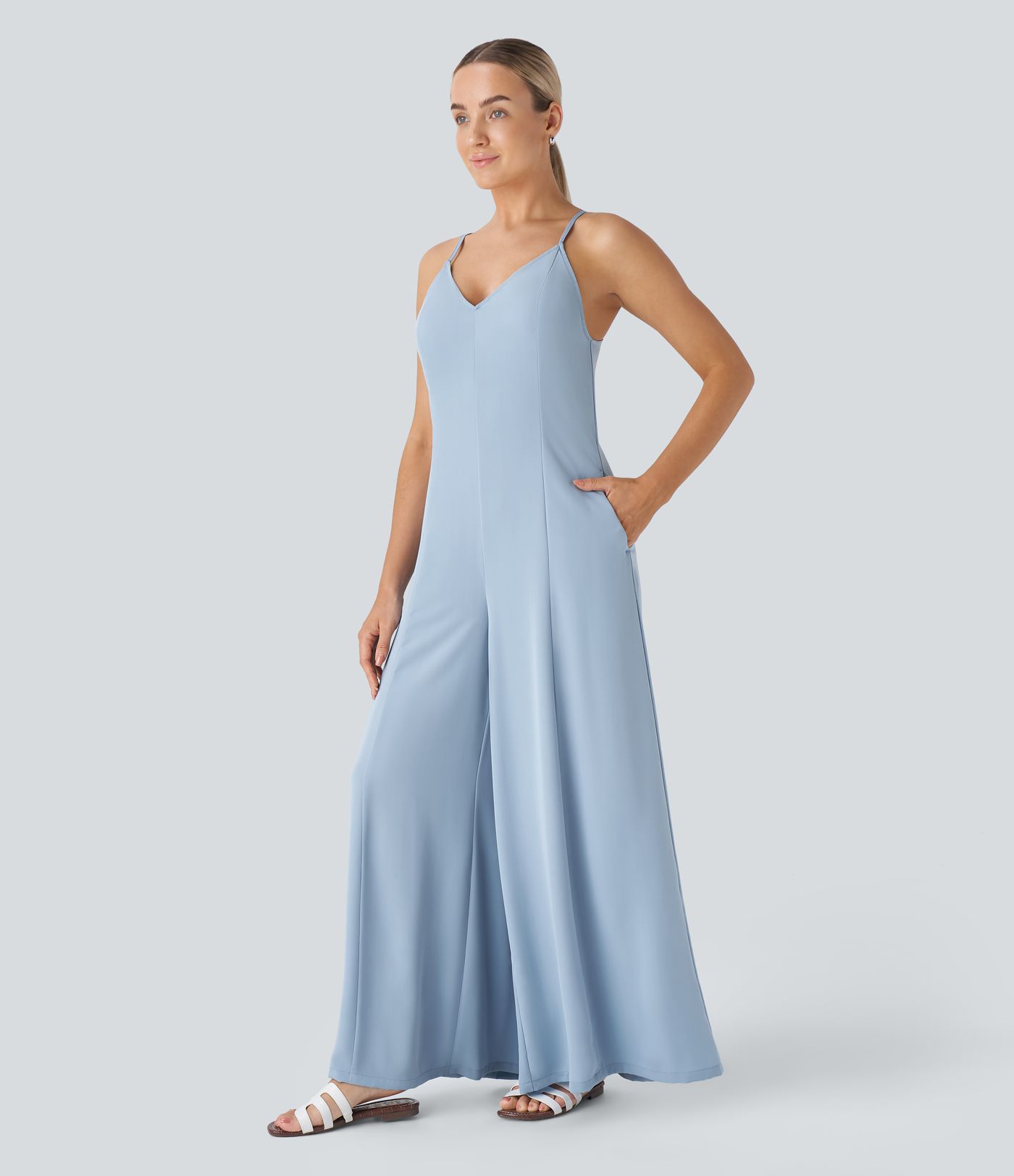 Backless crisscross lace-up with adjustable straps hidden zipper side pockets wide leg resort jumpsuit