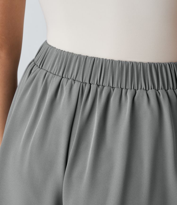 Pantalón corto oficina plisado bolsillo lateral botón decorativo tiro alto