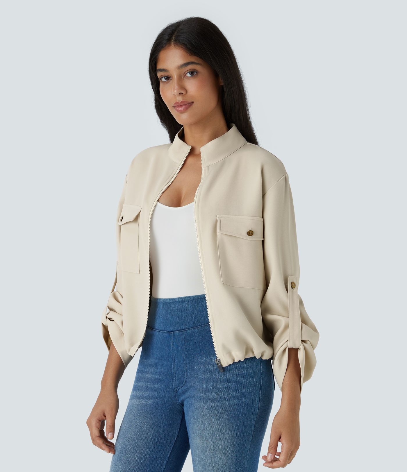 Stand collar Roll tab Sleeves Flap pocket Drawstring inside Hem zip Casual jacket